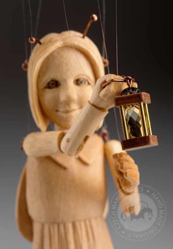 The smallest marionette in the world - a hand-carved wooden Ladybug